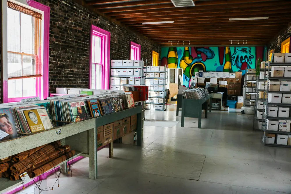 Euclid Records’ sales floor, with crates of vinyl, brick walls and pink-framed windows.