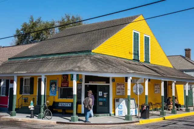 Frady’s One Stop Food Store, a yellow corner building with a covered porch.