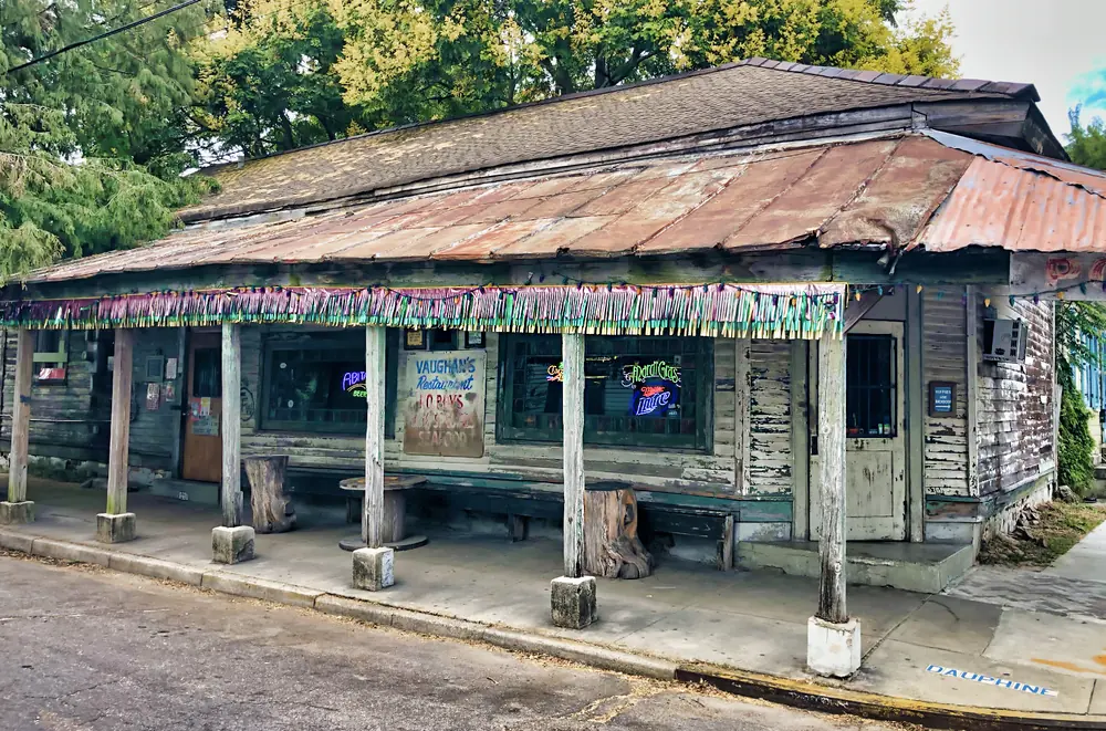 Vaughan’s Lounge, a low corner building with a rusted metal roof and a covered porch.