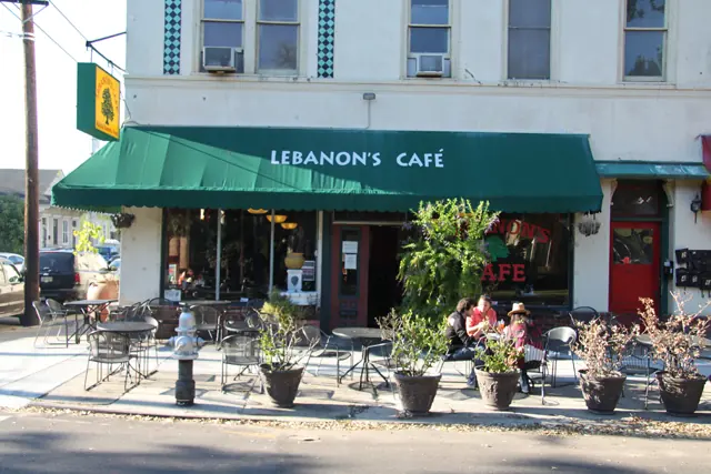 Lebanon’s Café with its green awning and sidewalk tables on Carrollton Avenue.